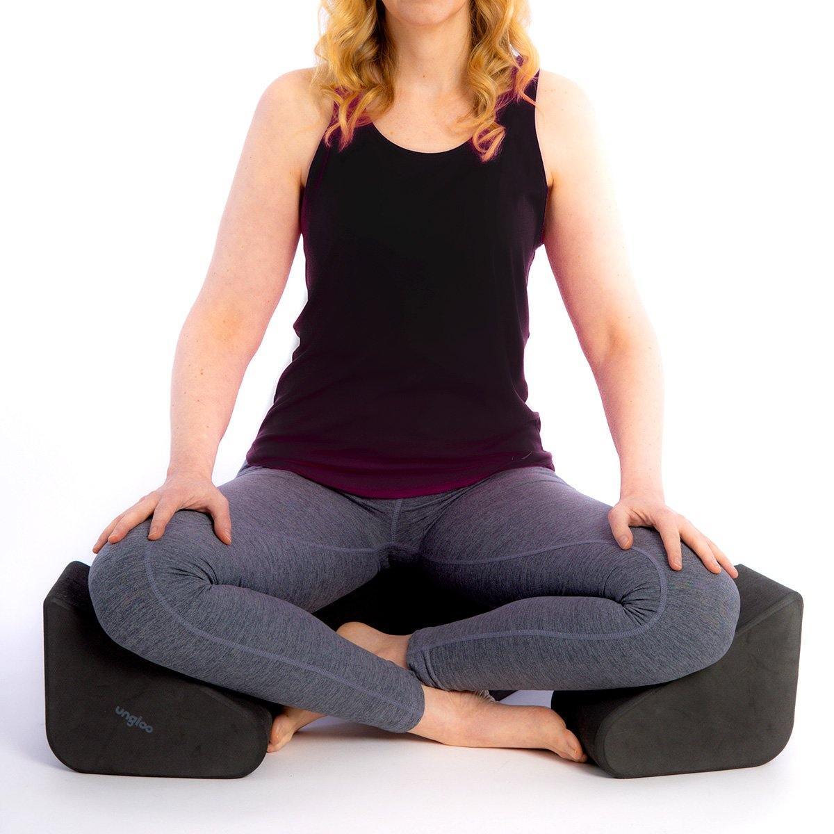 Picture of woman using the sitblox meditation supports for her knees and hips.